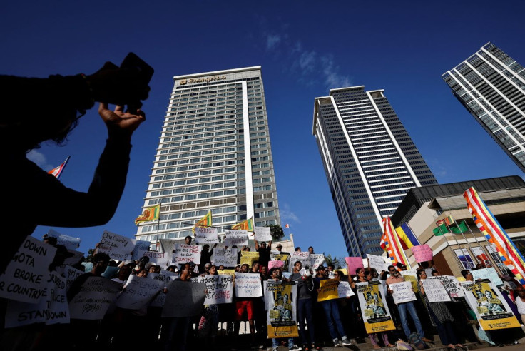 Anti-government demonstrators hold placards as they shout slogans during a protest demanding the arrest of former Prime Minister Mahinda Rajapaksa, amid the country's economic crisis, in Colombo, Sri Lanka, May 17, 2022.
