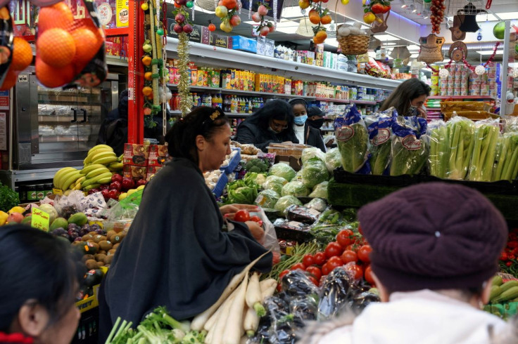 People shop at a supermarket in London, Britain, December 24, 2021. 