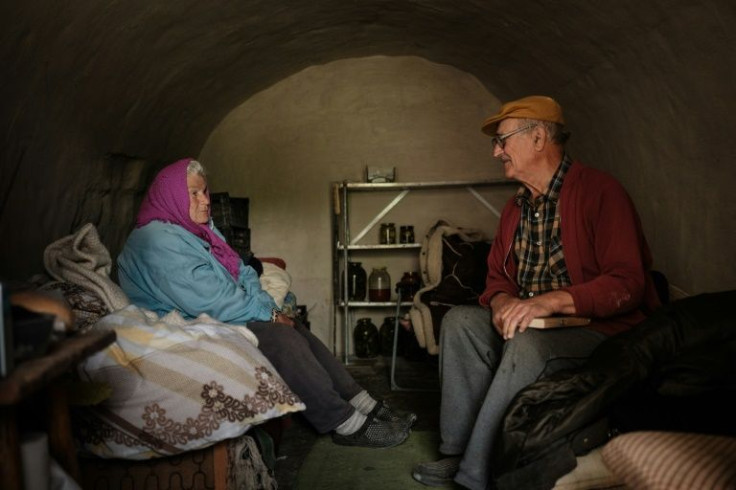 Ukrainians such as professor Oleksiy Polyakov and his wife Galina refuse to leave the front, hoping Russia's creeping advance can still be repelled