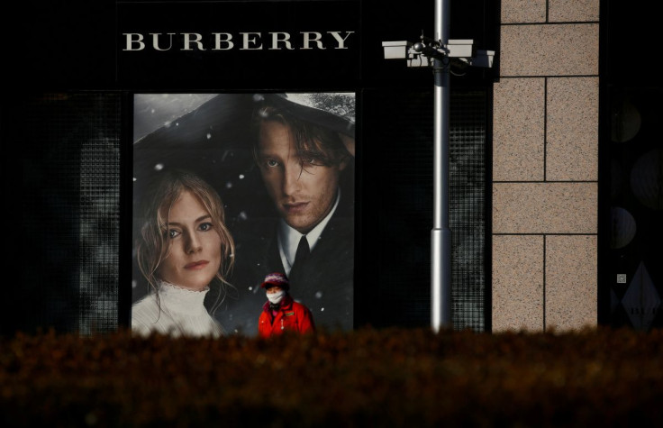 A woman walks past a Burberry boutique in Beijing, China, December 1, 2016. 