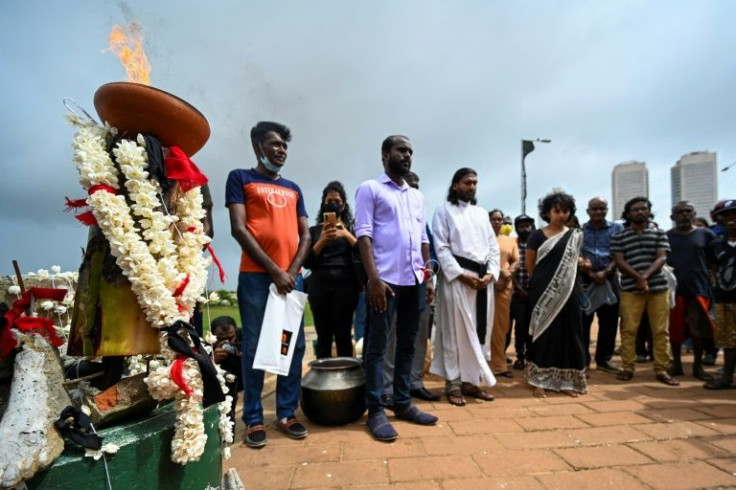 Anti-government demonstrators gather in remembrance of the thousands of minority Tamil civilians killed in the decades-long separatist war
