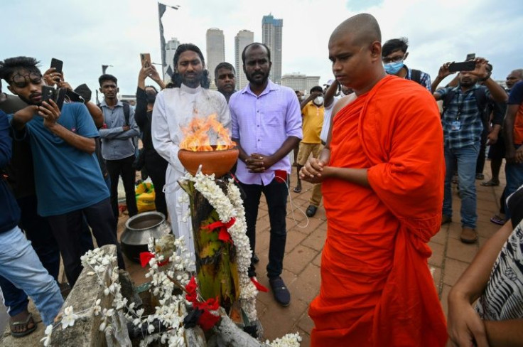 Clergy from Buddhist, Hindu and Christian communities offered prayers in Colombo and lit a clay lamp for those who perished between 1972 and May 2009 when fighting ended