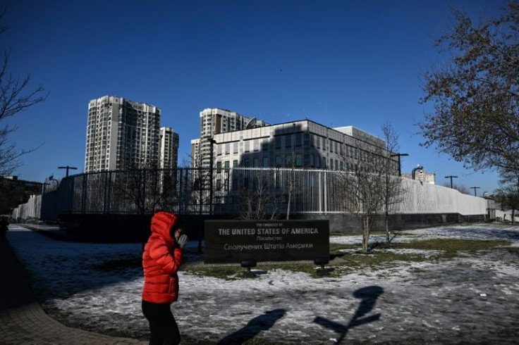 A woman passes by the closed US embassy in Kyiv after it closed 10 days ahead of the Russian invasion on February 24.