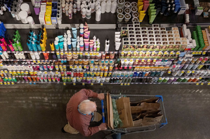 A person pushes a shopping cart in a supermarket in Manhattan, New York City, U.S., March 28, 2022. 