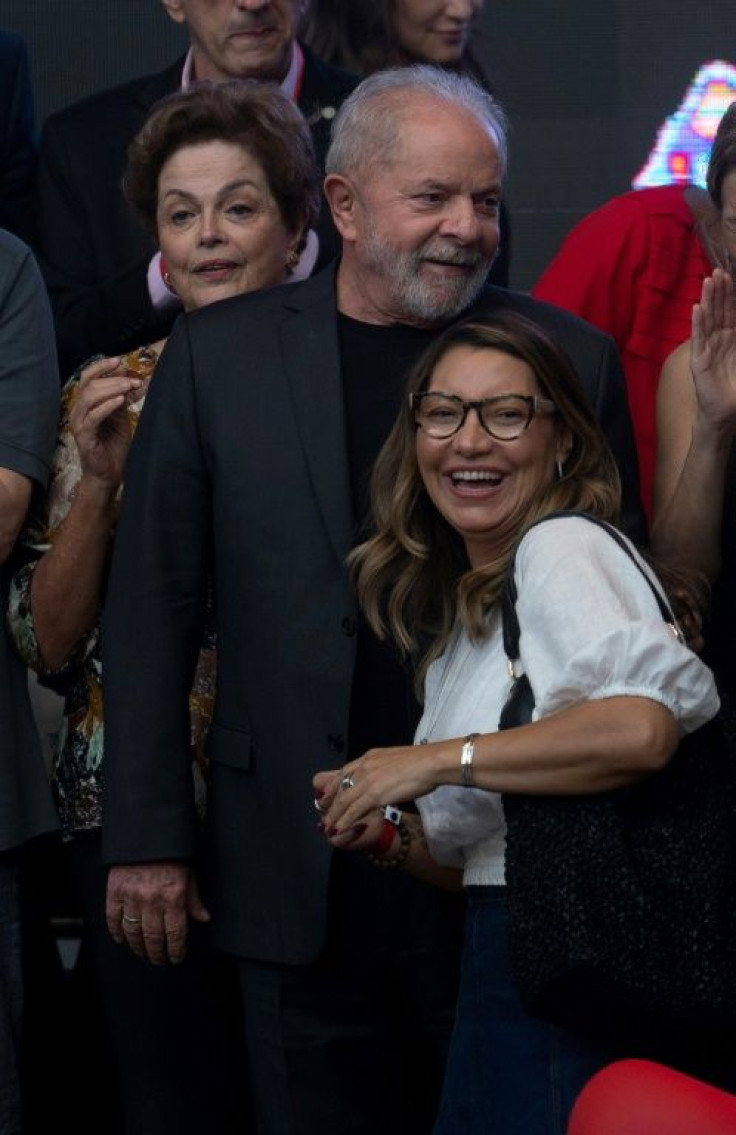 Former Brazil president Lula hugs his wife-to-be Rosangela da Silva during a workshop at the Rio State University in March 2022