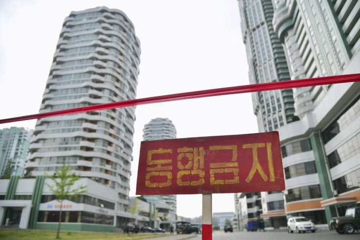 A sign is seen on a street closed to traffic, amid growing fears over the spread of the coronavirus disease (COVID-19), in Pyongyang, North Korea, in this photo released by Kyodo on May 18, 2022. Kyodo/via REUTERS 