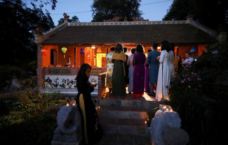 Buddhist monks from Dieu Ngu Temple in Westminster, California, chant during a candlelight vigil to mark the one million U.S. lives lost in the coronavirus disease (COVID-19) pandemic, as well as the victims of the shootings in Buffalo and Laguna Woods, i