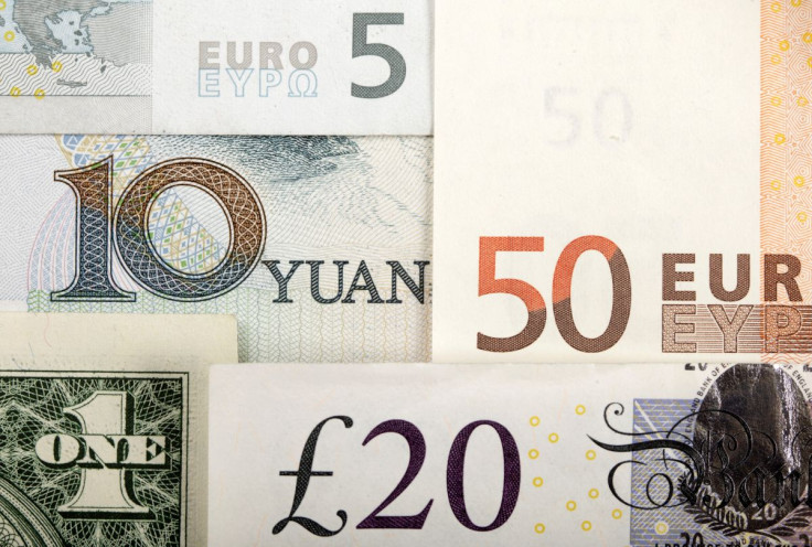FILE PHOTO - Arrangement of various world currencies including Chinese Yuan, US Dollar, Euro, British Pound, pictured January 25, 2011 