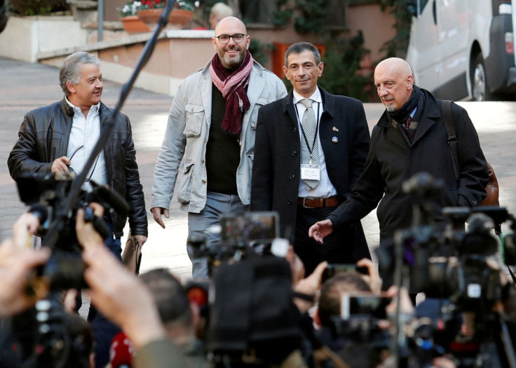 Pedro Salinas, Francois Devaux, Francesco Zanardi and Peter Iseley, survivors of sexual abuse, talk to reporters outside the Vatican in Rome, Italy February 20, 2019. 