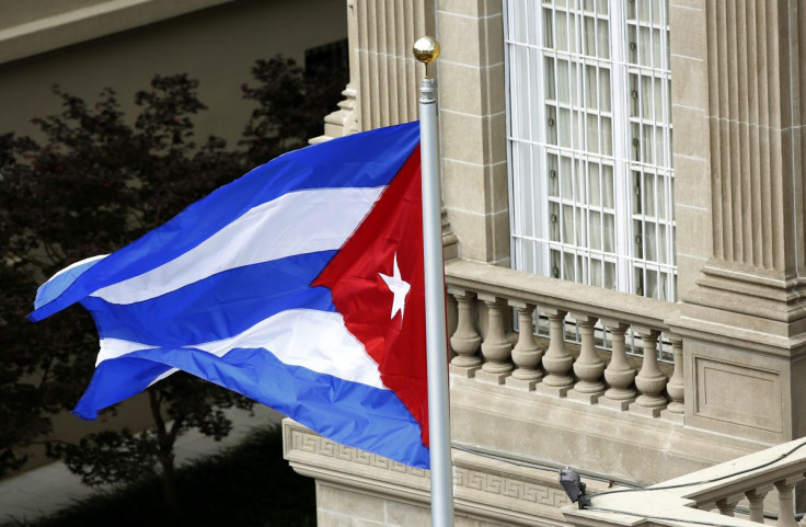 The Cuban flag flutters in the wind after being raised at the Cuban Embassy reopening ceremony in Washington July 20, 2015. 