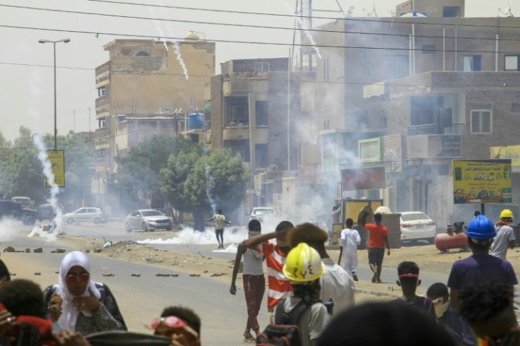 Sudanese demonstrators threw tear gas canisters back at security forces in the capital Khartoum