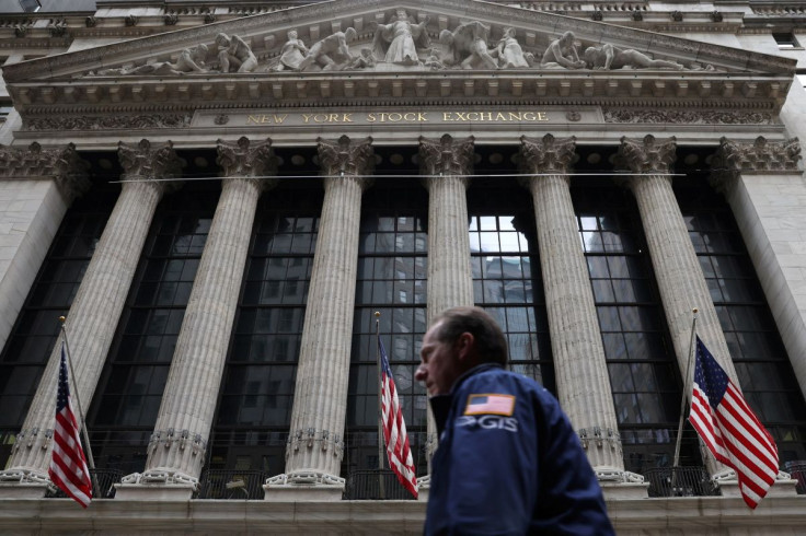 A trader walks by the New York Stock Exchange (NYSE) in Manhattan, New York City, U.S., May 19, 2022. 