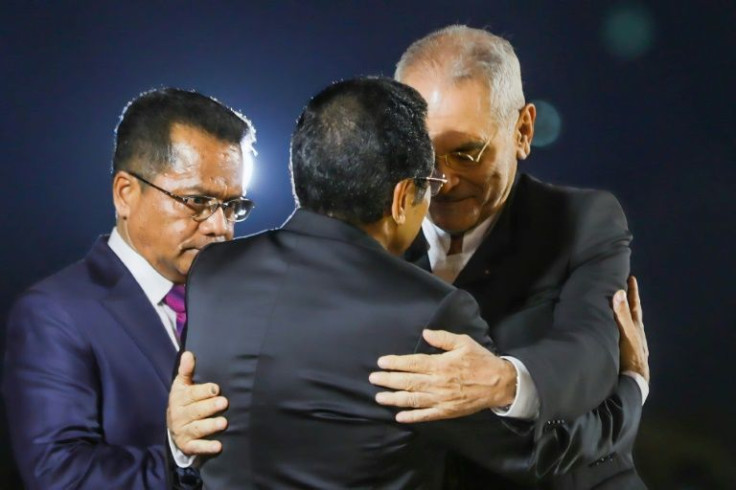 East Timor's new leader Jose Ramos-Horta (R) receives an embrace from his presidential predecessor Francisco Guterres, known as Lu Olo, ahead of an inauguration ceremony in Dili