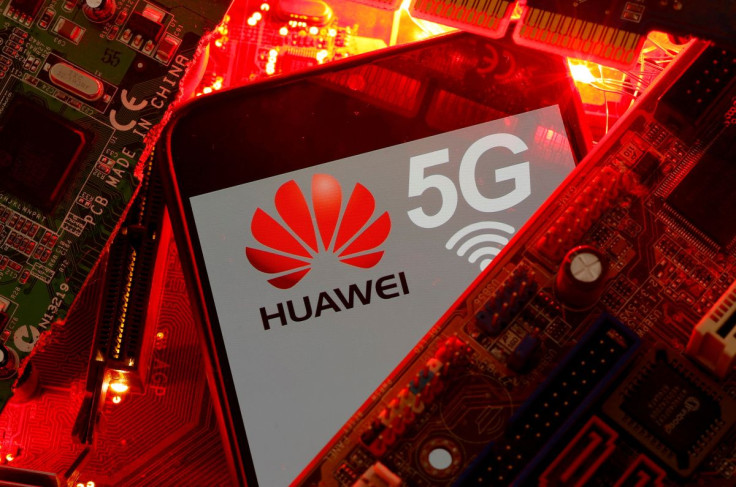 A smartphone with the Huawei and 5G network logo is seen on a PC motherboard in this illustration picture taken January 29, 2020. 