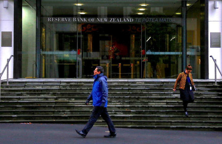 Pedestrians walk near the main entrance to the Reserve Bank of New Zealand located in central Wellington, New Zealand, July 3, 2017.   