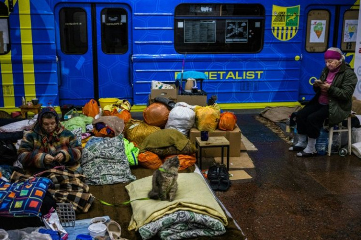 People shelter in an underground subway station in Kharkiv, eastern Ukraine