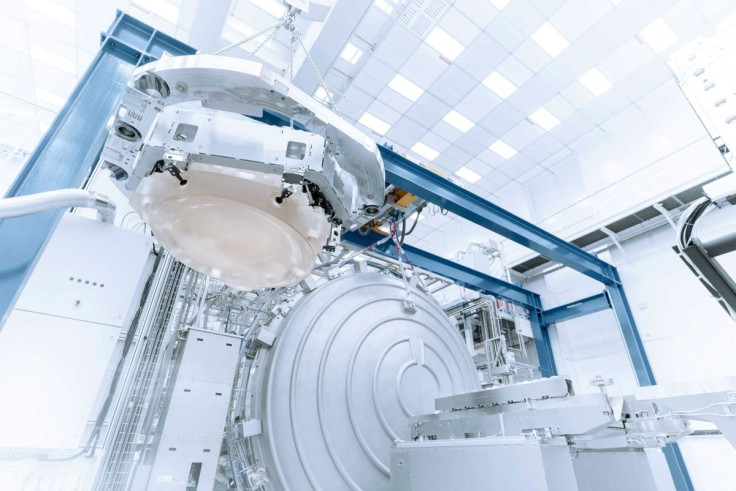 An optical system is prepared for testing in a vacuum chamber at Carl Zeiss SMT in Oberkochen, Germany, in this undated handout photo. Zeiss is developing optical systems that will go into the newest tool being developed by ASML of the Netherlands to crea