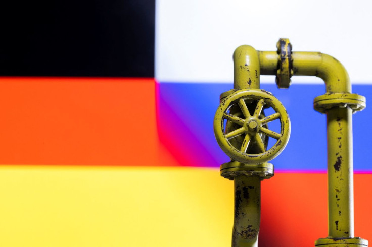 A model of the natural gas pipeline is seen in front of displayed German and Russian flag colours in this illustration taken April 26, 2022. 