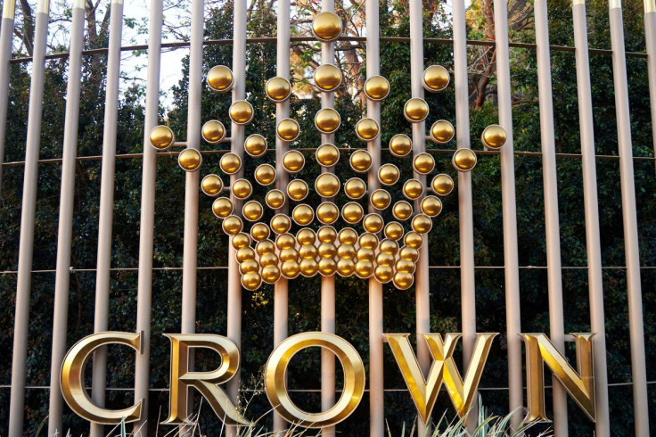 The logo of Australian top casino operator Crown Resorts adorns a fence surrounding the Crown Perth hotel and casino complex in Western Australia, Oct. 20, 2016.