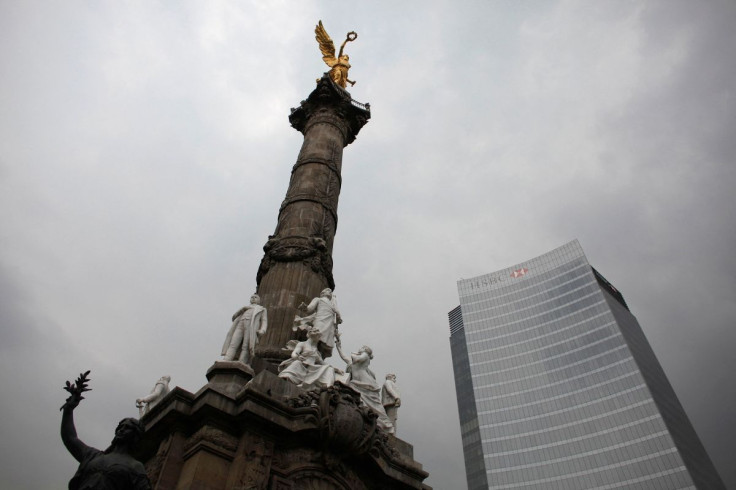 The Angel of Independence monument stands next to British bank HSBC's headquarters in Mexico City July 17, 2012.  