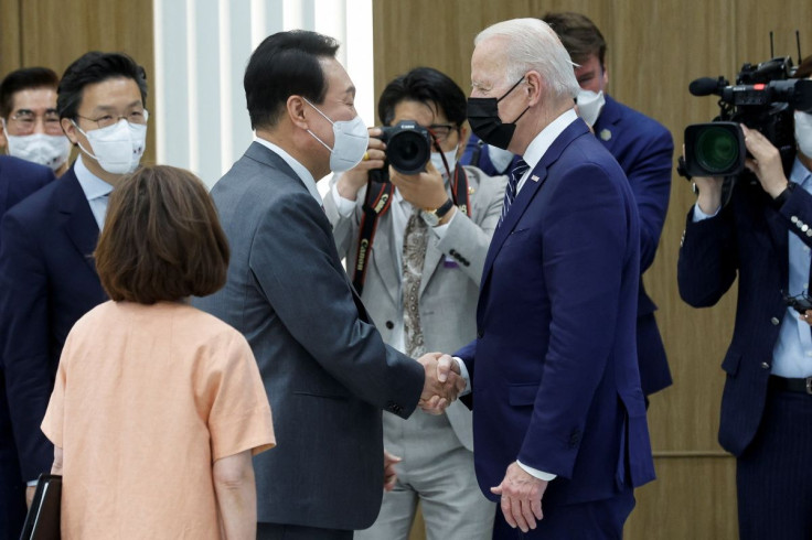 South Korean President Yoon Suk-yeol, with Samsung Electronics Vice Chairman Lee Jae-yong, greets U.S. President Joe Biden during a visit to a semiconductor factory at the Samsung Electronics Pyeongtaek Campus in Pyeongtaek, South Korea, May 20, 2022. 