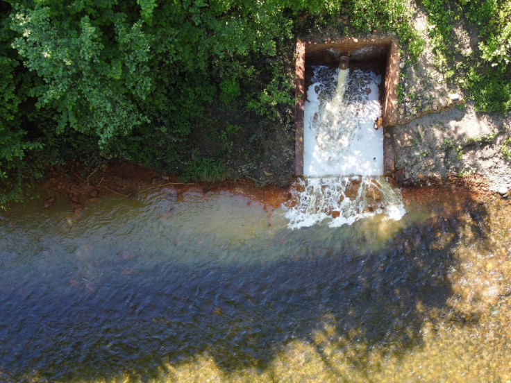 The polluted sludge and mining water containing high levels of arsenic from an iron ore mine flows into the river Slana near Nizna Slana, Slovakia May 18, 2022. Picture taken with a drone on May 18, 2022. 