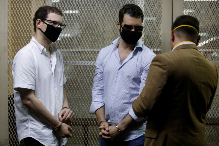 Ricardo (2nd L) and Luis Enrique, sons of former Panamanian President Ricardo Martinelli, talk to their lawyer after being detained to face extradition to the U.S. on money laundering charges, in Guatemala City, Guatemala July 6, 2020. 