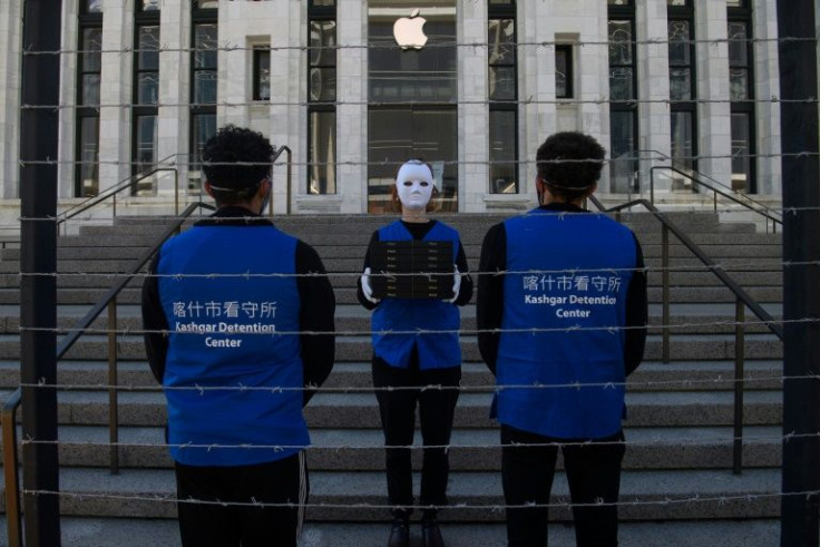 Activists set up a mock Uyghur forced labor camp outside the Apple flagship store in Washington in March 2022