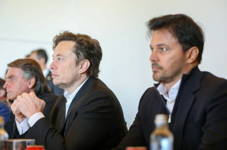 The meeting between Brazilian President Jair Bolsonaro (L), his Communication Minister Fabio Faria (R) and SpaceX CEO Elon Musk was kept under wraps until just hours before it happened