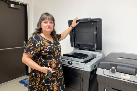Carol Asher, clerk of Denton Township, shows the voting tabulators to which Michigan State Representative Daire Rendon sought access after the 2020 election, in Denton Township, Michigan, U.S. May 19, 2022. Picture taken May 19, 2022. 