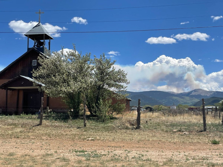 Smoke rises from the Calf Creek Hermits Peak fire in this picture taken in Llano, New Mexico, U.S May 18, 2022. Picture taken May 18, 2022. 