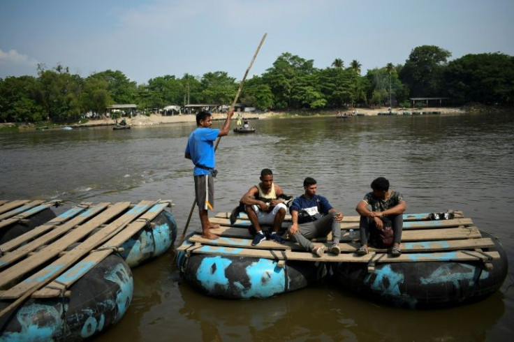 Gilberto Rodriguez (second from left) and his dog Negro had to share food often on their journey from Venezuela toward the United States