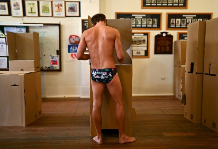 A man casts his vote at a polling station near Sydney's Bondi Beach on May 21, 2022.