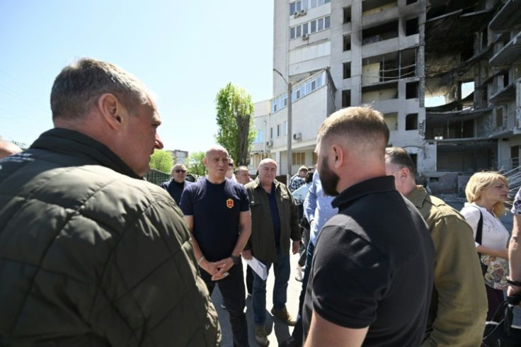 Odessa Mayor Gennady Trukhanov visits the scene of a recent air strike to reassure residents