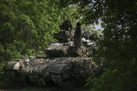 Ukrainian soldiers like this tank crew in the eastern district of Lysychans'k are facing an intense Russian offensive to capture the Donbas region