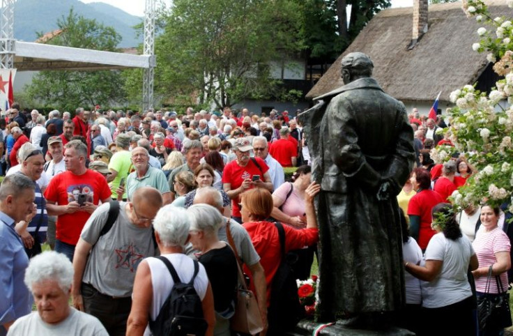 Supporters gather in front of a statue of the late Yugoslav leader Josip Broz Tito in the village of Kumrovec on Saturday