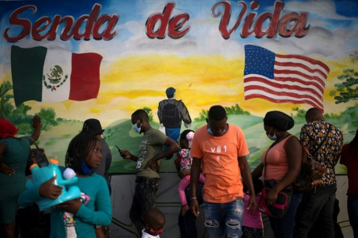 Haitian migrants are seen outside the Senda de Vida (Path of Life) shelter in the Mexican border city of Reynosa