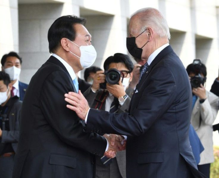 South Korean President Yoon Suk-yeol greets US President Joe Biden in Seoul on Biden's first trip to Asia since taking office
