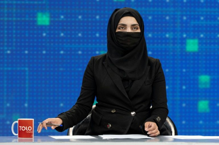 Tolonews presenter Thamina Usmani was among the women on Afghanistan's leading news channels to go air with their faces covered Sunday, a day after defying a Taliban order to do so
