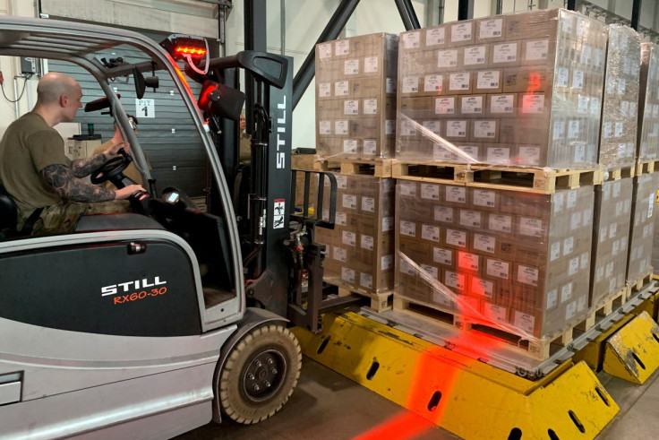 Soldiers load up boxes of baby formula ready for first shipments to U.S from Europe at Ramstein U.S. army base, Germany, May 21, 2022, to attempt to combat a critical shortage in the U.S.    