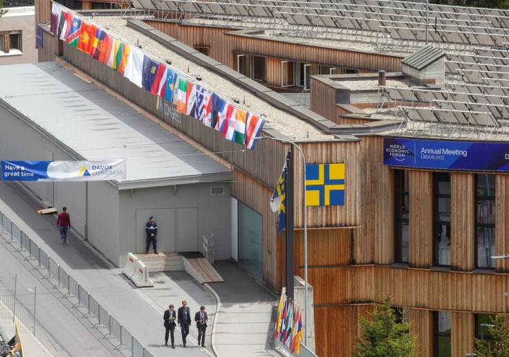 People walk past the congress center, the venue of the World Economic Forum 2022 (WEF) in the Alpine resort of Davos, Switzerland May 22, 2022.  