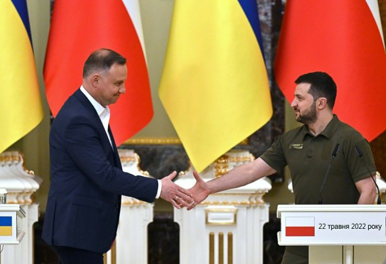 Polish President Andrzej Duda (L) told Ukraine's parliament that 'business with usual' with Russia going forward was now impossible