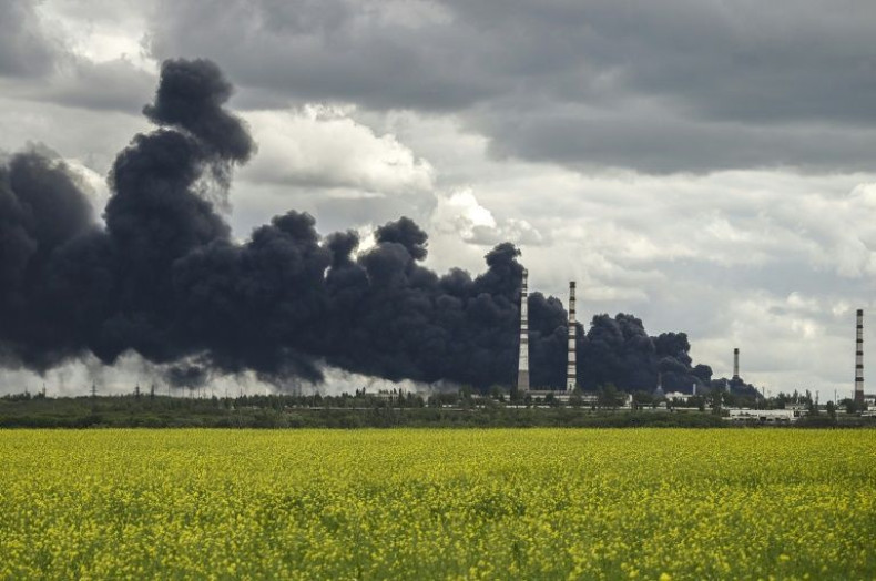 Smoke rises from an oil refinery after an attack outside the city of Lysychansâk in Ukraine's Donbas region