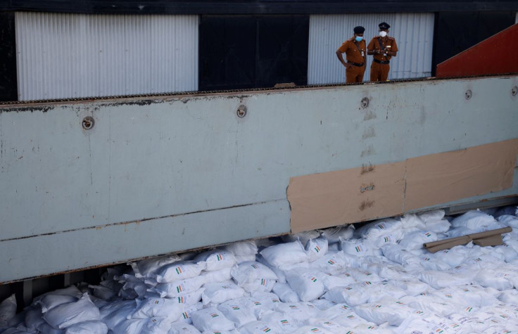 Members of security personnel stand on a cargo ship carrying essential supplies of rice, milk and some critically needed medicines from India, amid Sri Lanka's economic crisis, at a port in Colombo, Sri Lanka, May 22, 2022. Picture taken on May 22, 2022. 