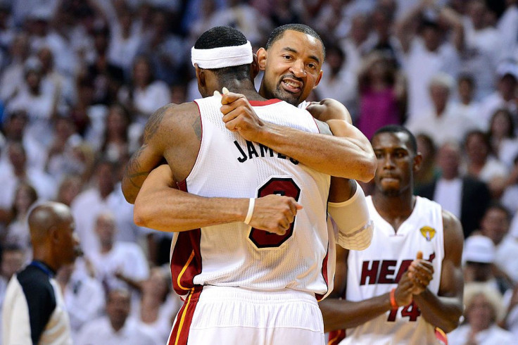 Juwan Howard #5 of the Miami Heat celebrates with LeBron James #6