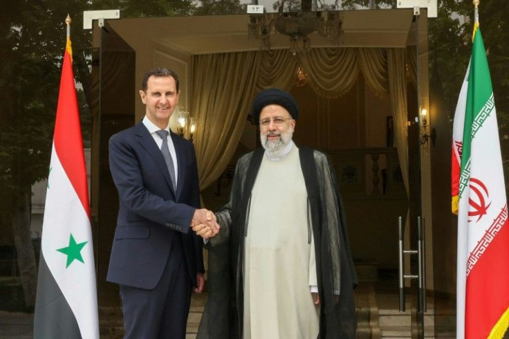 Iranian President Ebrahim Raisi, on the right, received Syrian President Bashar al-Assad in Tehran on May 8, 2022