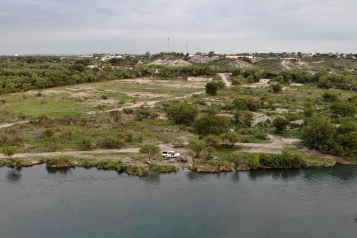 People attend a picnic on the southern bank of the Rio Grande as U.S. authorities, blocked by a federal judge from lifting COVID-19 restrictions, known as Title 42, that empower agents at the U.S.-Mexico border to turn back migrants without giving them a 