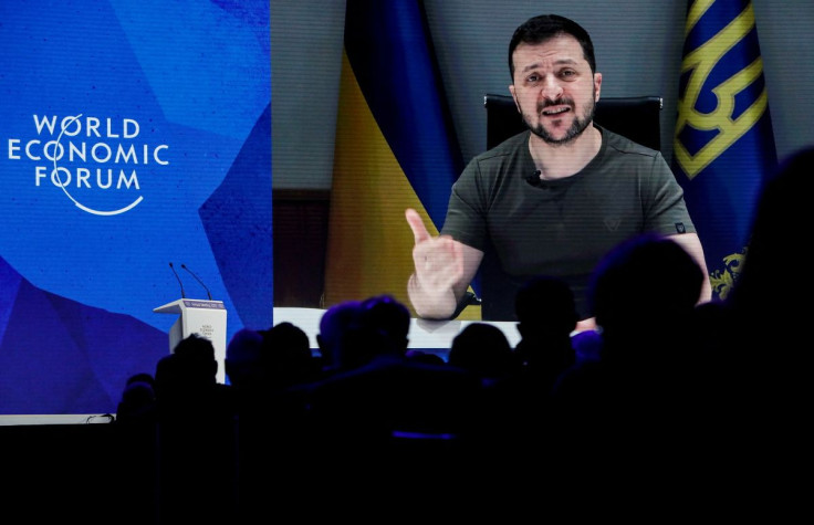 Ukraine's President Volodymyr Zelenskiy is seen on a screen as he delivers a video address to the delegates of the World Economic Forum (WEF)  in Davos, Switzerland May 23, 2022. 