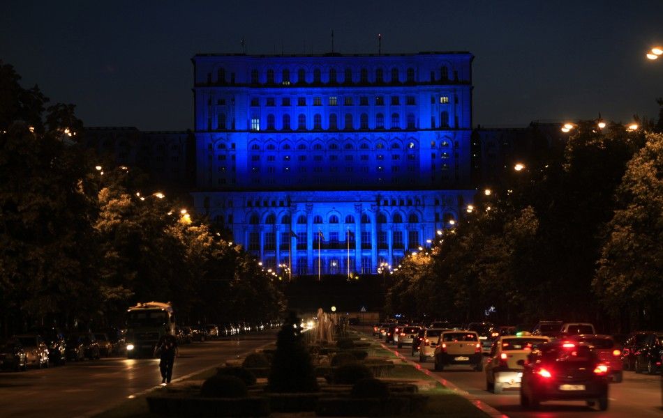 Romania039s Parliament Palace, the largest administrative building in the world is lit in blue to mark the World Refugee Day in Bucharest