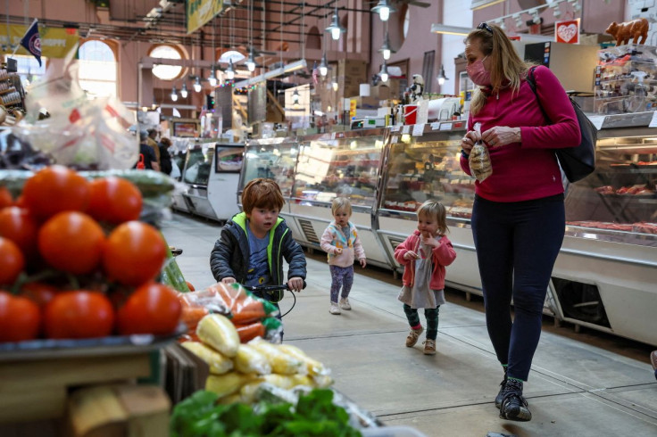 People shop at the Eastern Market in Washington, U.S., February 11, 2022. 